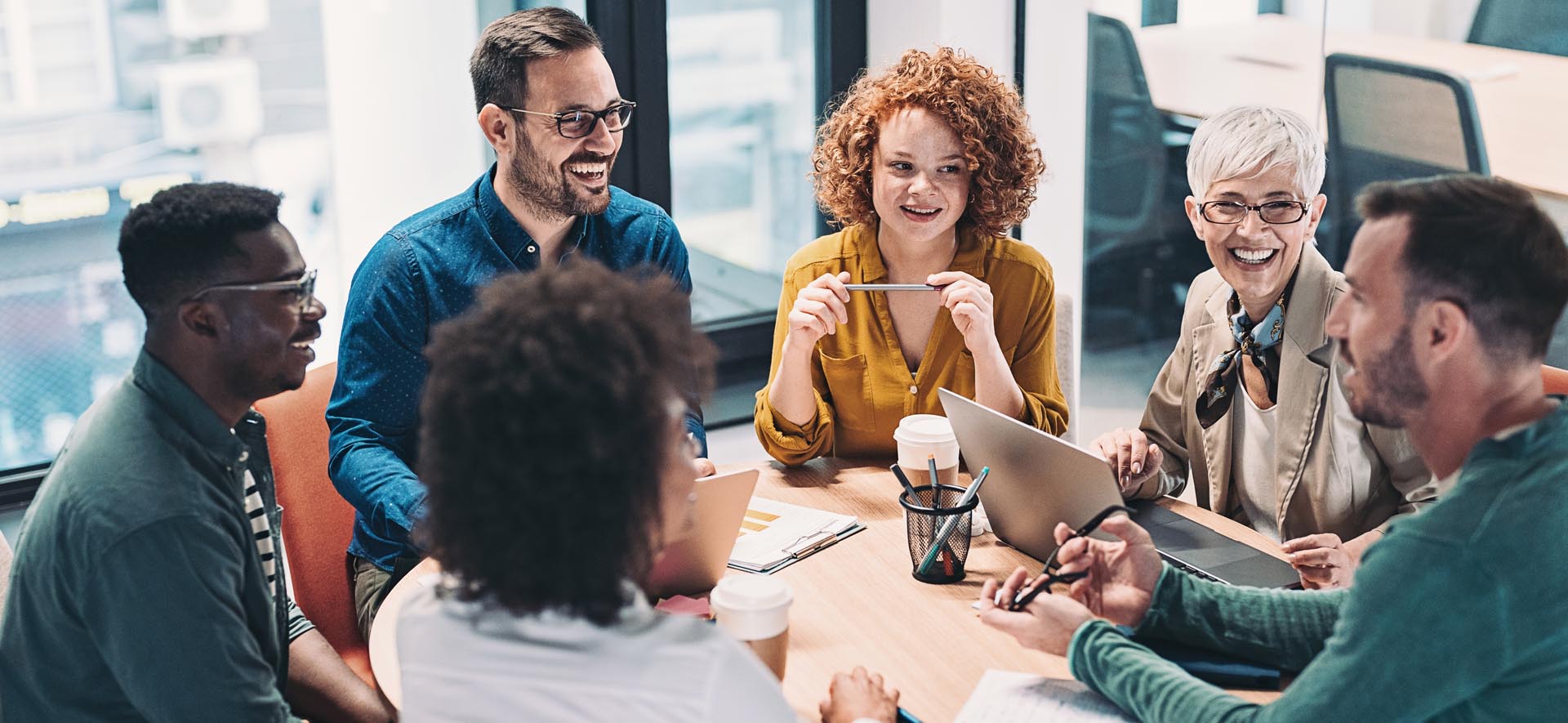 people-sitting-around-rounded-table people-sitting-around-rounded-table